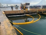 Photo of oil recovery site at Pier 9 in San Juan Harbor, Puerto Rico April 29, 2024. Coast Guard Sector San Juan Incident Management personnel continue oil clean-up oversight efforts that began April 1, 2024, for an unknown discharge source that is affecting Pier 9 and the nearby land-based storm drainage system. Coast Guard has contracted Clean Harbors Environmental Service, Inc., to conduct oil recovery operations for the incident. (Courtesy photo)
