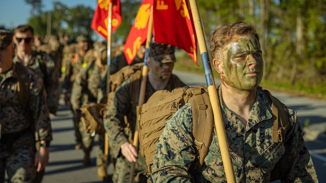 U.S. Navy Petty Officer 3rd Class Nicholas Horning, a Lancaster, Pennsylvania native and a hospital corpsman with 2d Marine Division (MARDIV), participates in a six mile hike during the Doc Kent competition on Camp Lejeune, North Carolina, April 23, 2024. This hike is held annually to commemorate Aaron A. Kent, a U.S. Navy Hospitalman, who was assigned with 2d MARDIV, II Marine Expeditionary Force and killed in action during combat in Operation Iraqi Freedom in 2005. (U.S. Marine Corps photo by Pfc. Micah Thompson)