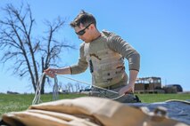 Airman rolling up rope
