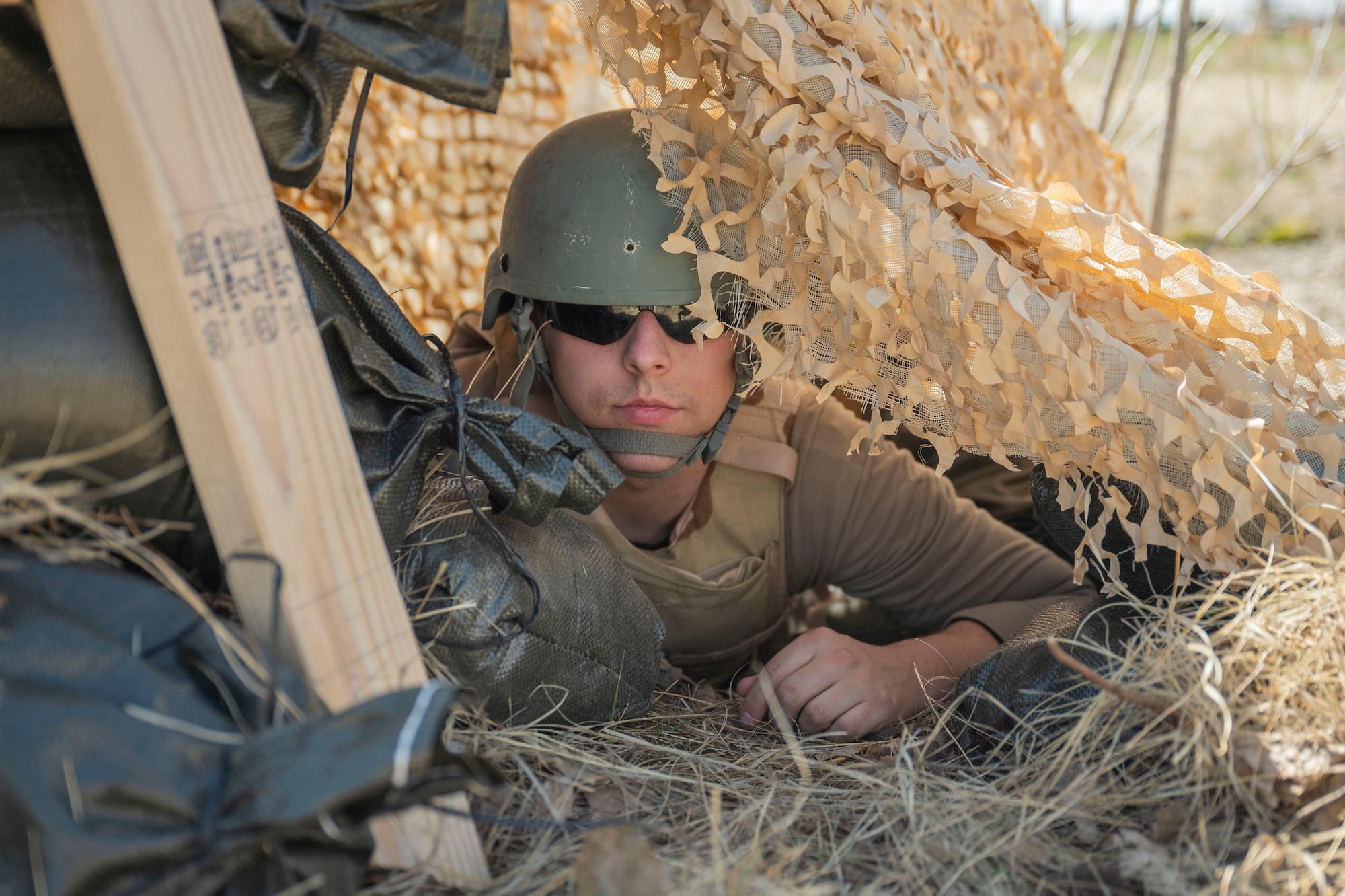 Airman sitting in a tent
