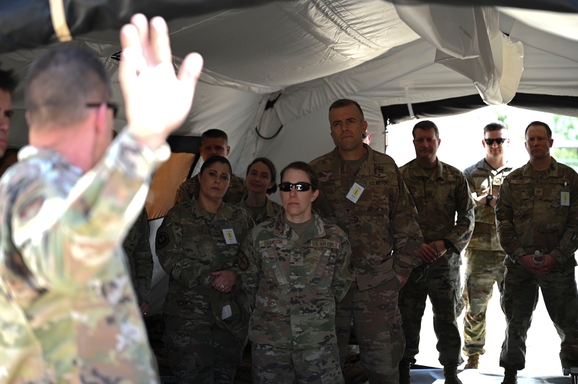 U.S. Air Force Maj. Christopher Perry, 313th Training Squadron director of operations, briefs the 14N Development Team about the development timeline of the Joint All Domain Exercise Forward Operations Readiness Generation Exercise training site, Goodfellow Air Force Base, Texas, April 24, 2024. JADE FORGE provides joint service intel warriors with a realistic training environment preparing Airmen for real-world scenarios. (U.S. Air Force photo by Airman 1st Class Madison Collier)