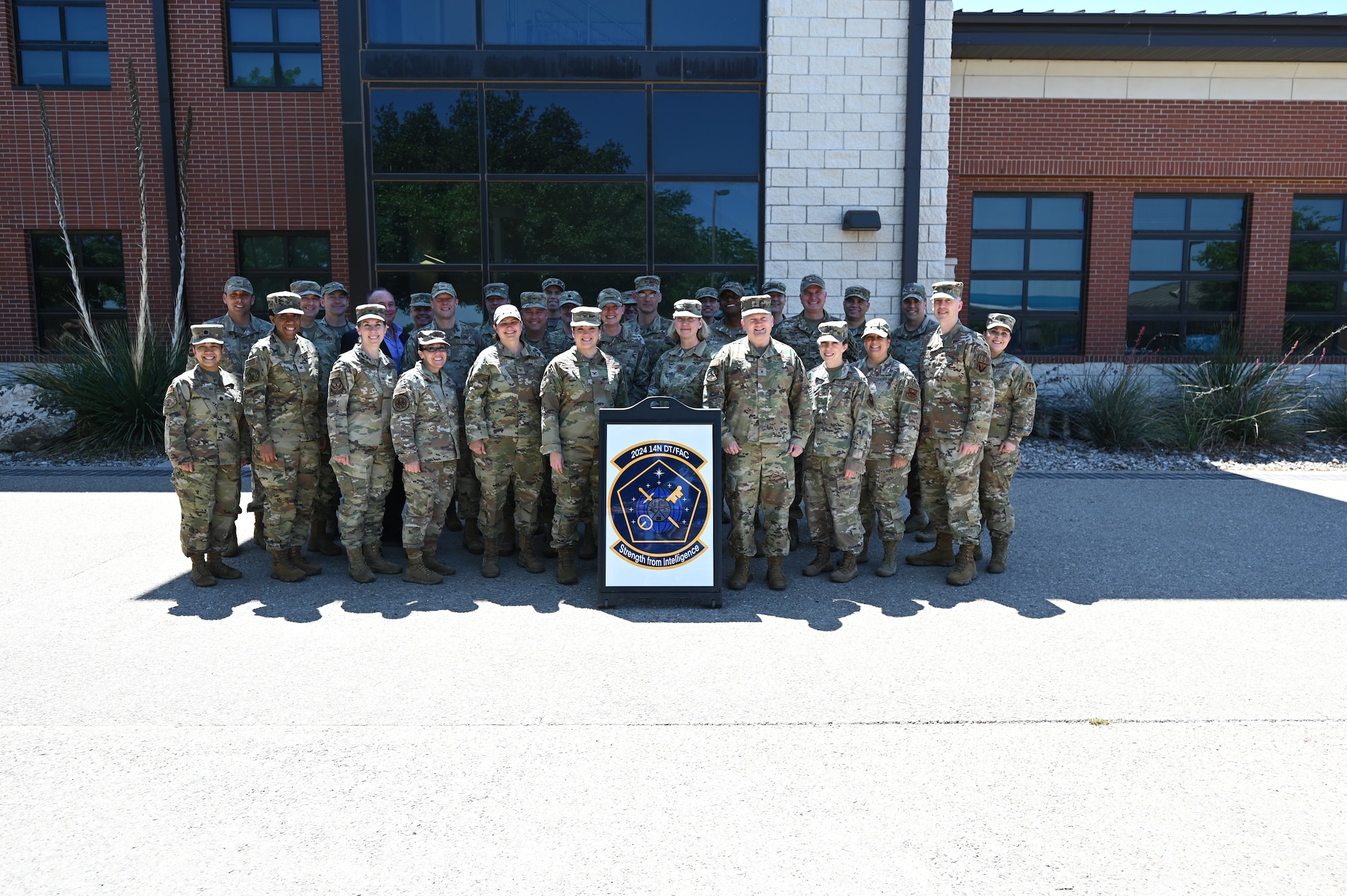 The 14N Development Team/Functional Advisory Council poses for a picture outside the Consolidated Learning Center, Goodfellow Air Force Base, Texas April 23, 2024. The 14N Development Team oversees officer development and talent management to develop the intelligence surveillance reconnaissance workforce deliberately. (U.S. Air Force photo by Airman James Salellas)