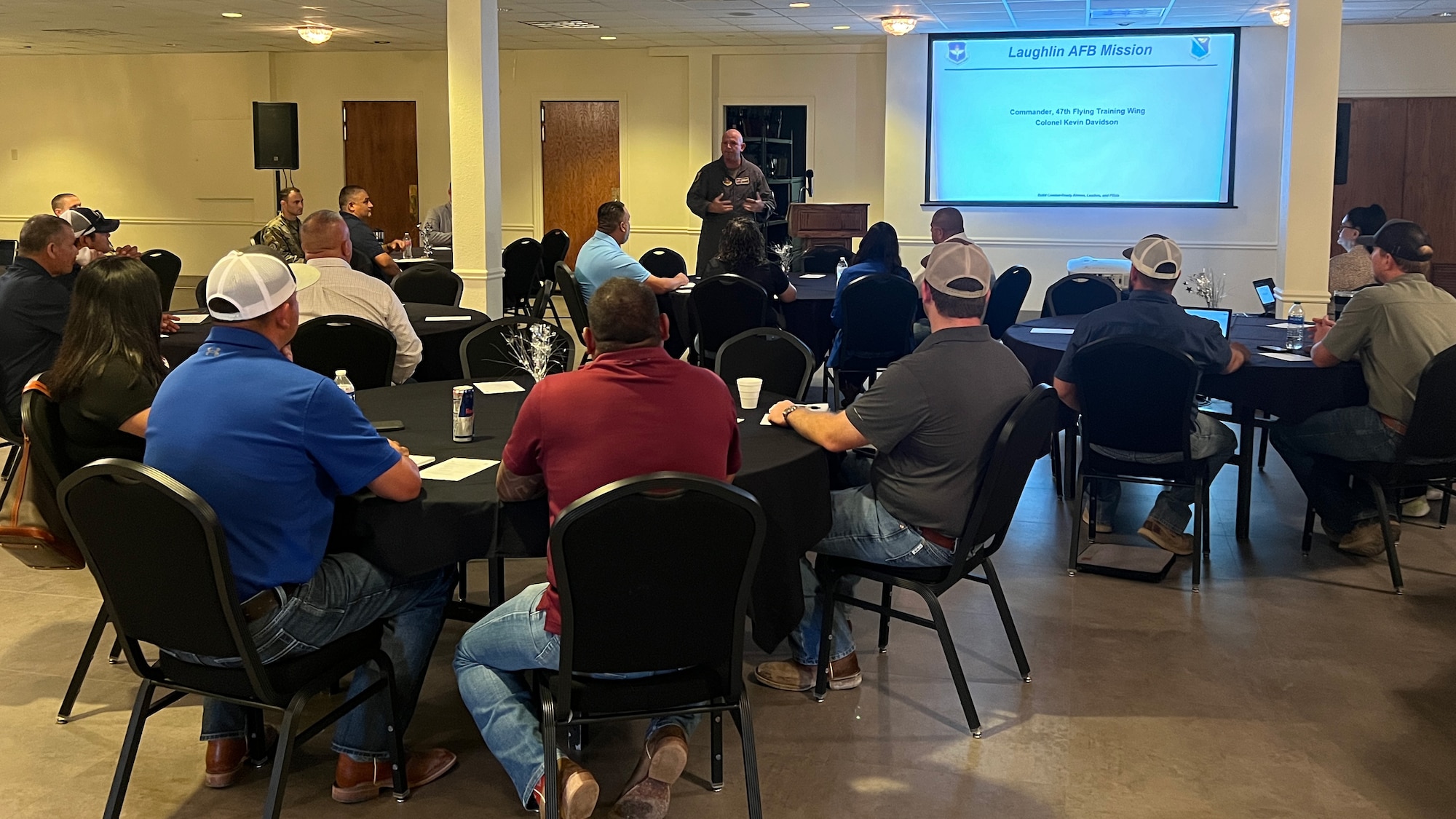 U.S. Air Force Col. Kevin Davidson, 47th Flying Training Wing commander, briefs small business owners about contracts for services and construction at Laughlin Air Force Base, Texas, April 26, 2024. The event brought over 25 local and small businesses on base to educate them on how to partner with the base for upcoming construction projects and services needed. (U.S. Air Force photo by Staff Sgt. Nicholas Larsen)