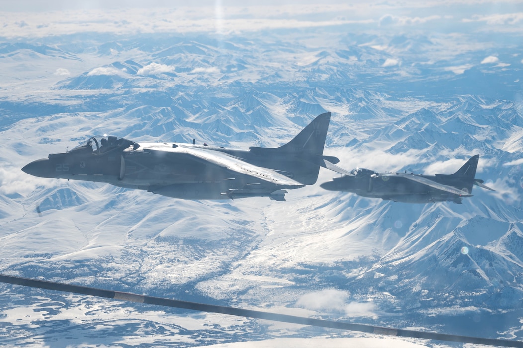 Two AV-8B Harrier II’s assigned to the Marine Attack Squadron (VMA) 223 fly in the Joint Pacific Alaska Range Complex during Red Flag-Alaska 24-1, Alaska, April 25, 2024.