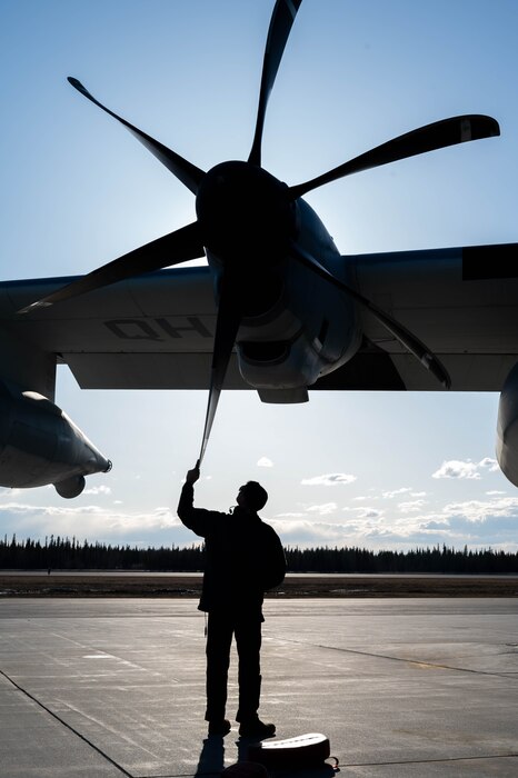 A Marine assigned to the Marine Aerial Refueler Transport Squadron (VMGR) 234 performs a propeller check post flight during Red Flag-Alaska 24-1 at Eielson Air Force Base, Alaska, April 25, 2024.