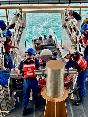 The crew of USCGC Oliver Henry (WPC 1140) takes Guam Delegate James Moylan and key staff underway in the ship's small boat in Apra Harbor, Guam, on April 25, 204. They spent the afternoon with crews, gaining firsthand insights into the critical operations of the region's Fast Response Cutters (FRCs). The delegation also toured essential infrastructure sites, including the damaged glass breakwater and the Port Authority of Guam, from the cutter and the cutter small boat. These sites are essential for military readiness, impact shipping routes, and influence the economic activity and cost of goods in the Marianas. (U.S. Coast Guard photo by Chief Warrant Officer Sara Muir)