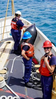 The crew of the USCGC Oliver Henry (WPC 1140) stand special sea detail as they take a congressional delegation underway in Guam on April 26, 2024. The delegation spent the afternoon with the crew, gaining firsthand insights into the critical operations of the region's Fast Response Cutters (FRCs). The delegation also toured essential sites of infrastructure, including the damaged glass breakwater and the Port Authority of Guam, from the cutter and the cutter small boat. These sites are essential for military readiness, impact shipping routes, and influence the economic activity and cost of goods in the Marianas. (U.S. Coast Guard photo by Chief Warrant Officer Sara Muir)