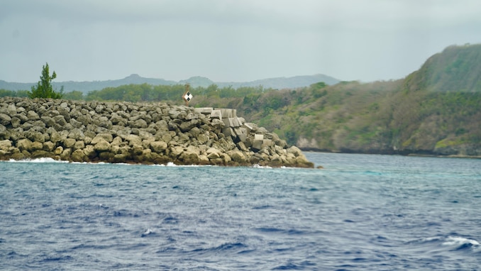 Glass break water, part of outer Apra Harbor, was damaged by Typhoon Mawar in 2023, as seen by a congressional delegation in Guam on April 26, 2024. The delegation spent the afternoon with U.S. Coast Guard crews, gaining firsthand insights into the critical operations of the region's Fast Response Cutters (FRCs). The delegation also toured essential infrastructure sites, including the damaged glass breakwater and the Port Authority of Guam, from the cutter and the cutter small boat. These sites are essential for military readiness, impact shipping routes, and influence the economic activity and cost of goods in the Marianas. (U.S. Coast Guard photo by Chief Warrant Officer Sara Muir)