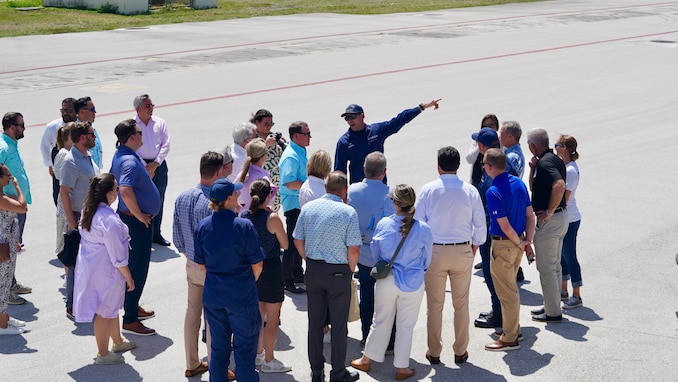 Lt. Ray Cerrato, commanding officer of USCGC Oliver Henry (WPC 1140) greets a distinguished congressional delegation led by Congressman Sam Graves, Chairman of the House Committee on Transportation and Infrastructure and Congressman Mike Bost, Chairman of the House Committee on Veterans Affairs at the unit in Guam on April 26, 2024. The delegation, which included Congressmen David Rouzer, Troy Nehls, and Mark DeSaulnier, along with Guam Delegate James Moylan and key staff from both committees, spent the afternoon with crews, gaining firsthand insights into the critical operations of the Fast Response Cutters (FRCs) in the region. The delegation also toured critical infrastructure sites, including the damaged glass breakwater and the Port Authority of Guam, from the cutter and the cutter small boat. These sites are essential for military readiness, impact shipping routes, and influence the economic activity and cost of goods in the Marianas. (U.S. Coast Guard photo by Chief Warrant Officer Sara Muir)