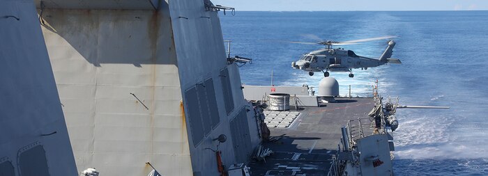 240430-N-CV021-1028 SOUTH CHINA SEA (April 30, 2024) A Sea Hawk helicopter (MH-60R) departs the Arleigh Burke-class guided-missile destroyer USS Howard (DDG 083) during flight quarters in the South China Sea, April 30. Howard is forward-deployed and assigned to Destroyer Squadron (DESRON) 15, the Navy’s largest DESRON and the U.S. 7th Fleet’s principal surface force. (U.S. Navy photo by Mass Communication Specialist 3rd Class Alexandria Esteban)