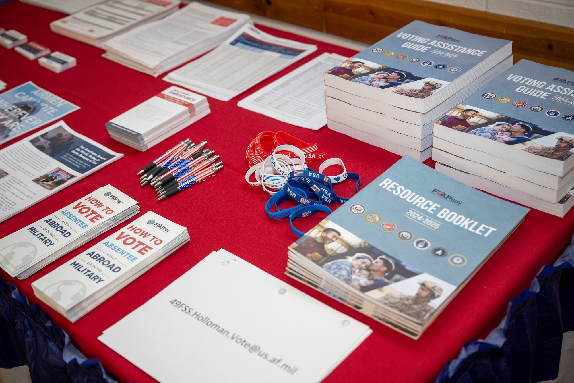 Pamphlets for voters and resource guides for Voting Assistance Officers are on display at a workshop for the Federal Voter Assistance Program at Holloman Air Force Base, New Mexico April 24, 2024.