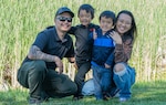 U.S. Air Force Master Sergeant Tom Nguyen, 660th Aircraft Maintenance Squadron maintenance expediter, left, and Senior Airman Sawako Nguyen, 60th Health Care Operations Squadron gastroenterology technician, right, pose for a family photo with their sons at Travis Air Force Base, April 27, 2024. May is designated as Asian and Pacific Islander Heritage Month when we recognize the continuing accomplishments of Asians and Pacific Islanders to our country. (U.S. Air Force photo by Randall Couch)