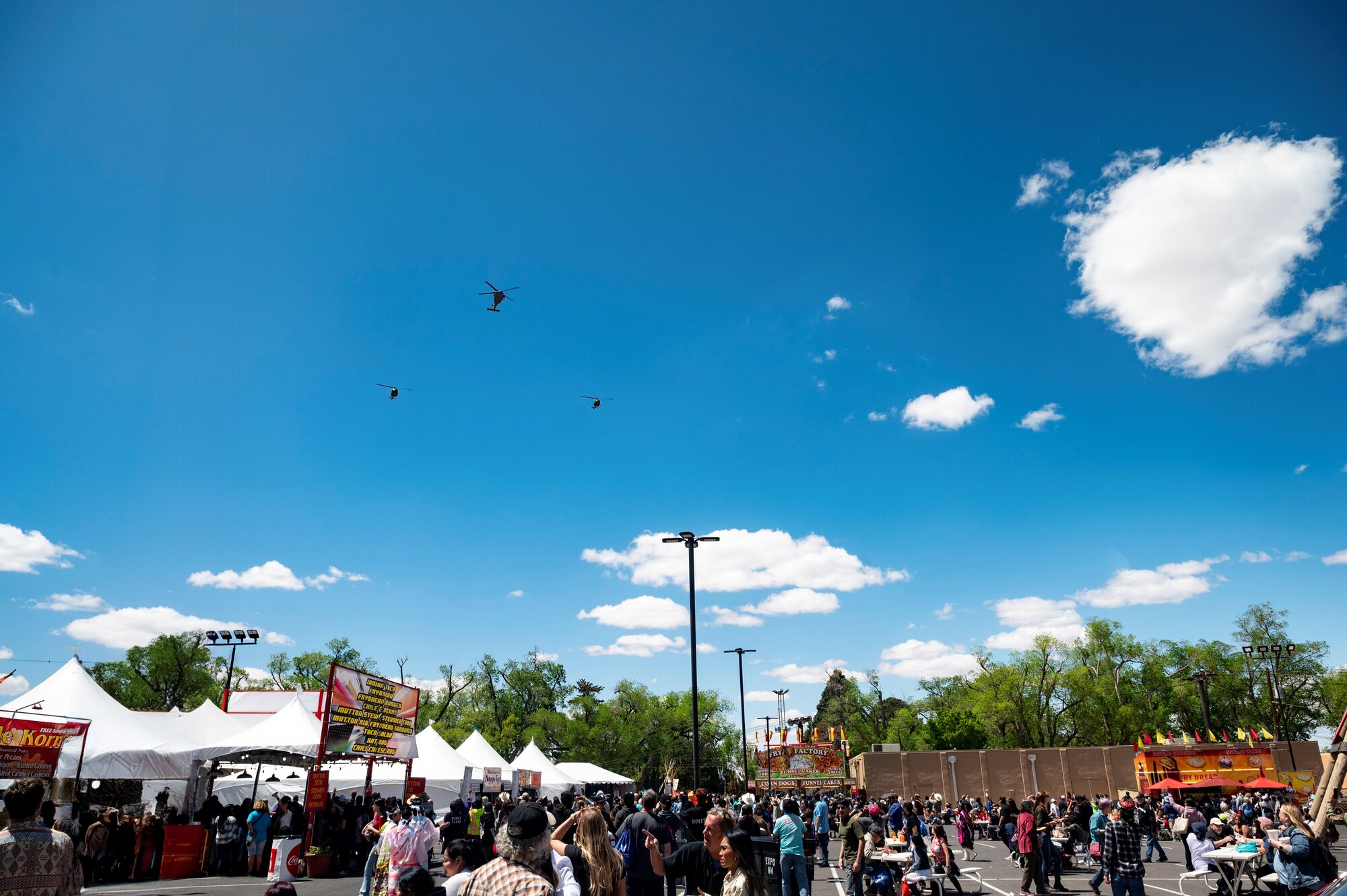 Helicopters flyover Gathering of Nations event.