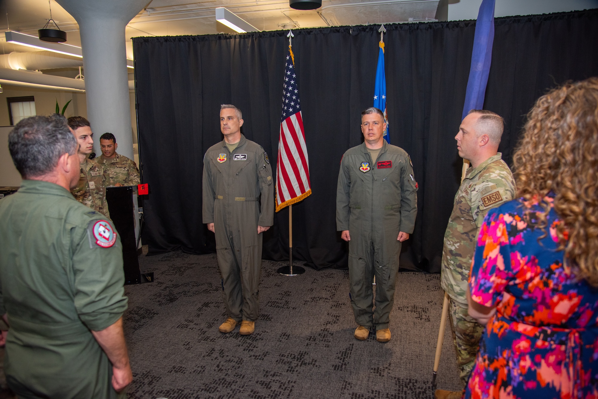 U.S. Air Force Col. Andrew J. Finkler, 850th Spectrum Warfare Group commander, left, and U.S. Air Force Lt. Col. Charles A. Friesz, 563rd Electronic Warfare Squadron commander, stand at attention as the new 563rd EWS guidon unfurls during the reactivation ceremony for 563rd EWS, San Antonio, Texas, April 25, 2024. The squadron was previously a as an electronic warfare and combat system officer training unit before it was deactivated in 2010. The 563rd EWS now performs software development to help modernize U.S. Air Force electronic warfare operations. (U.S. Air Force photo by Jarrod M. Vickers)