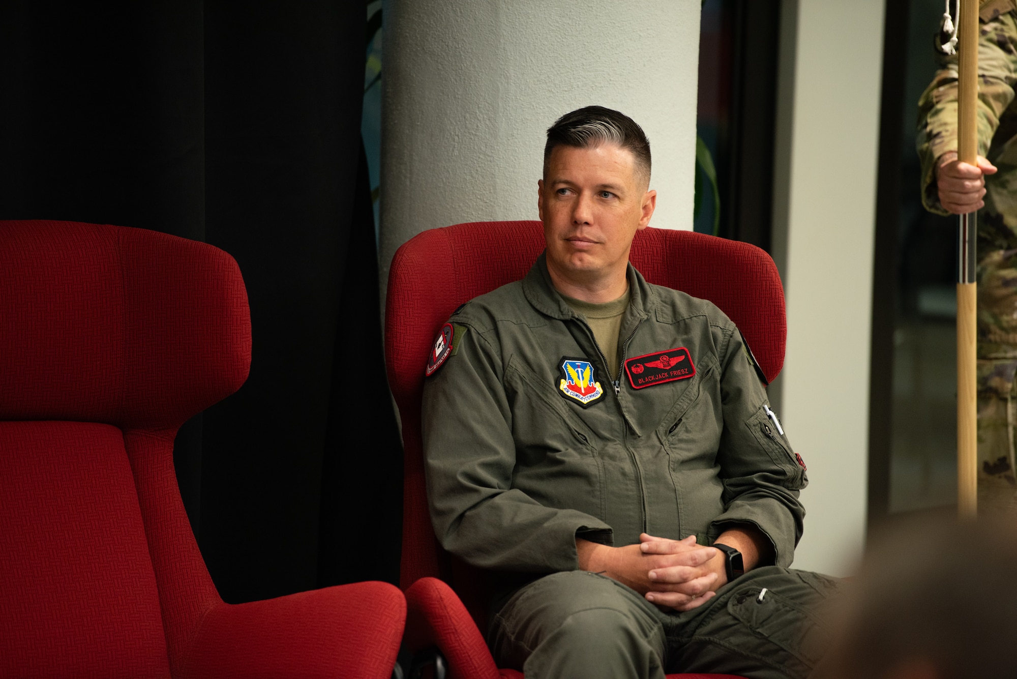 U.S. Air Force Lt. Col. Charles A. Friesz, 563rd Electronic Warfare Squadron commander, listens to opening remarks during the reactivation ceremony for 563rd EWS, San Antonio, Texas, April 25, 2024. Friesz is the first to assume command of this unit since its deactivation in 2010. The squadron previously conducted electronic warfare and combat system officer training before it was deactivated in 2010 but will now perform software development in support of the Air Force’s electromagnetic warfare operations. (U.S. Air Force photo by Jarrod M. Vickers)