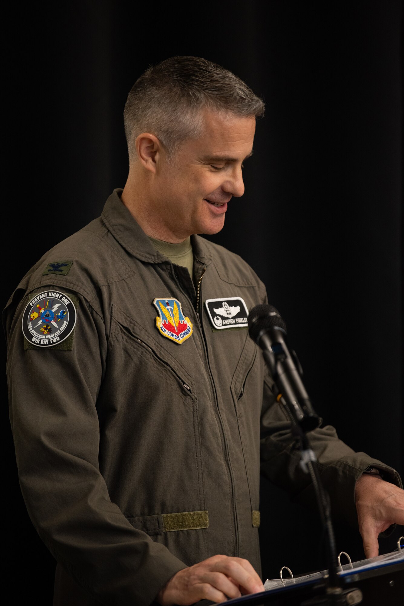 U.S. Air Force Col. Andrew J. Finkler, 850th Spectrum Warfare Group commander, delivers opening remarks during the reactivation ceremony for 563rd Electronic Warfare Squadron, San Antonio, Texas, April 25, 2024. Some attendees taught or underwent training while the 563rd EWS was previously active. The squadron deactivated in 2010 and now performs a software development mission to enhance 350th Spectrum Warfare Wing’s electromagnetic spectrum operations.  (U.S. Air Force photo by Jarrod M. Vickers)