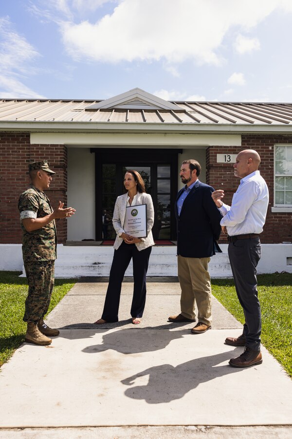 From left, U.S. Marine Corps Brig. Gen. Adolfo Garcia Jr., commanding general, Marine Corps Installations East-Marine Corps Base (MCB) Camp Lejeune speaks with Jessica Pierson, underground storage tank section head, David Towler, environmental quality branch head, and Robert Lowder, director, all with Environmental Management Division (EMD), after presenting the 2024 Secretary of the Navy Environmental Award for Environmental Restoration, Installation, on Marine Corps Base Camp Lejeune, North Carolina, May 1, 2024. EMD manages an ecologically diverse installation while continuously ensuring the protection of those living, working, and training on MCB Camp Lejeune. (U.S. Marine Corps photo by Cpl. Jennifer E. Douds)