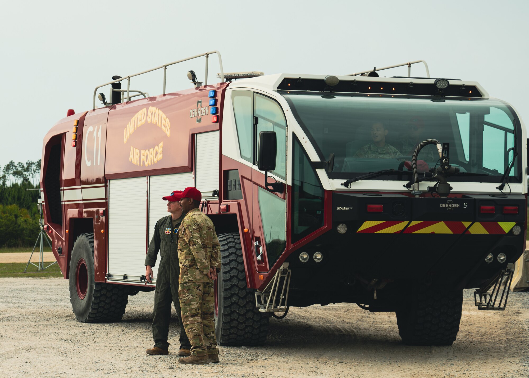 U.S. Air Force Maj. Gen. David B. Lyons discusses putting out fires with Staff Sgt. Adam Van Lang
