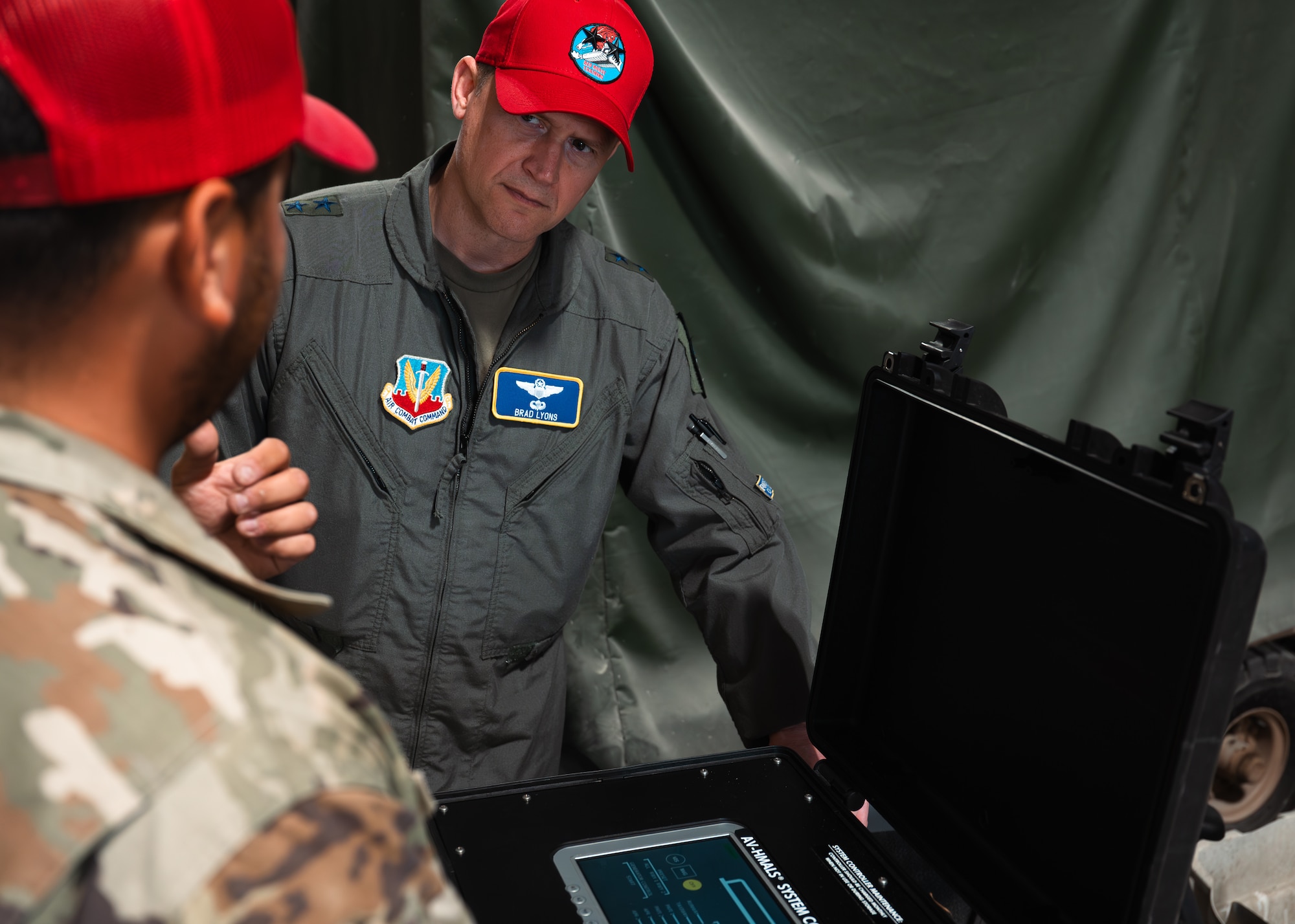 U.S. Air Force Maj. Gen. David B Lyons learns about the Expeditionary Airfield Lighting System-Charlie