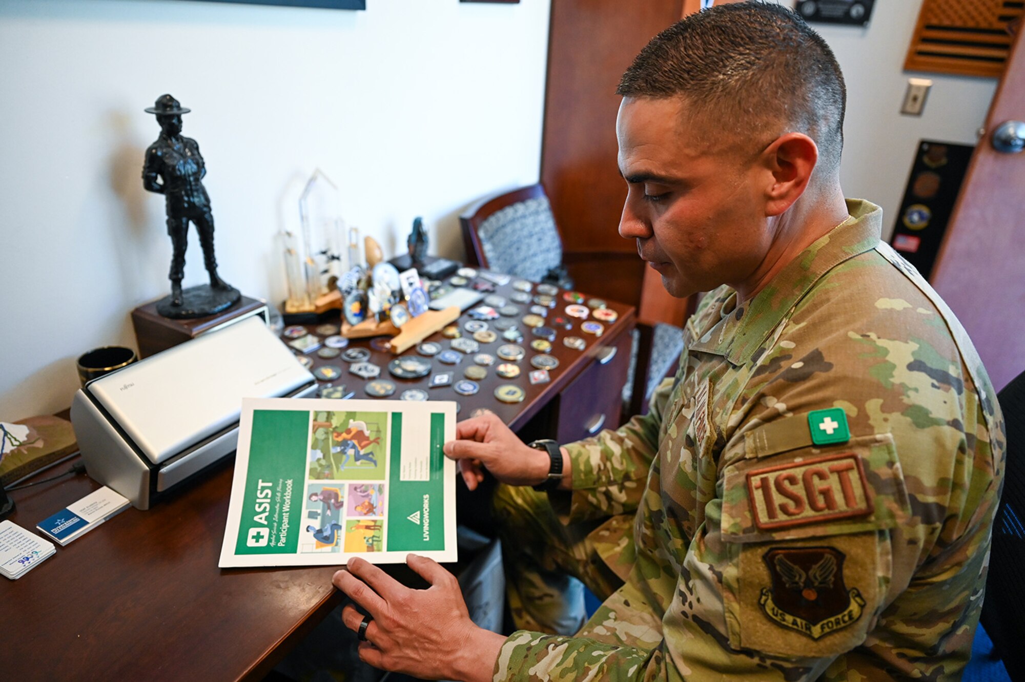 Seargent reads training material for ASIST.