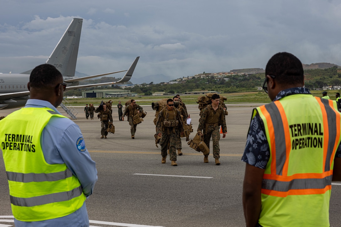 U.S. Marines and Sailors with Marine Rotational Force – Darwin 24.3 offload from a C-40A assigned to Marine Transport Squadron 1, Marine Aircraft Group 41, 4th Marine Aircraft Wing, Marine Forces Reserve, in preparation for a humanitarian aid and disaster relief exercise at Jacksons International Airport, Port Moresby, Papua New Guinea, April 30, 2024. The HADR exercise will be conducted in coordination with the Papua New Guinea Defense Force and U.S. Embassy in Port Moresby, with a focus on projecting select Role II medical, logistics, and Marine Air-Ground Task Force command and control capabilities off-continent, to validate HADR training and readiness. MRF-D 24.3 remains committed to maintaining readiness and fostering partnerships to ensure a swift and effective response to humanitarian crises wherever and whenever they may occur. (U.S. Marine Corps photo by Cpl. Juan Torres)