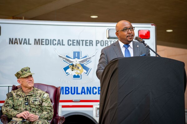 Naval Medical Center Portsmouth (NMCP) hosted the 25th Anniversary celebration of the Charette Health Care Center, or Building 2, April 30.  “Wow, what a full-circle moment for me,” said Glover as he accepted the flag and started his comments. “Twenty-five years ago, a symbol of healing and hope emerged on our city’s horizon, and Naval Medical Center Portsmouth has become an integral part of our community.”