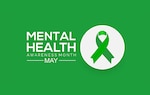 Green background with a white circle off centered with a green ribbon in the middle of the circle. The words "Mental Health Awarness Month are also off center in white.