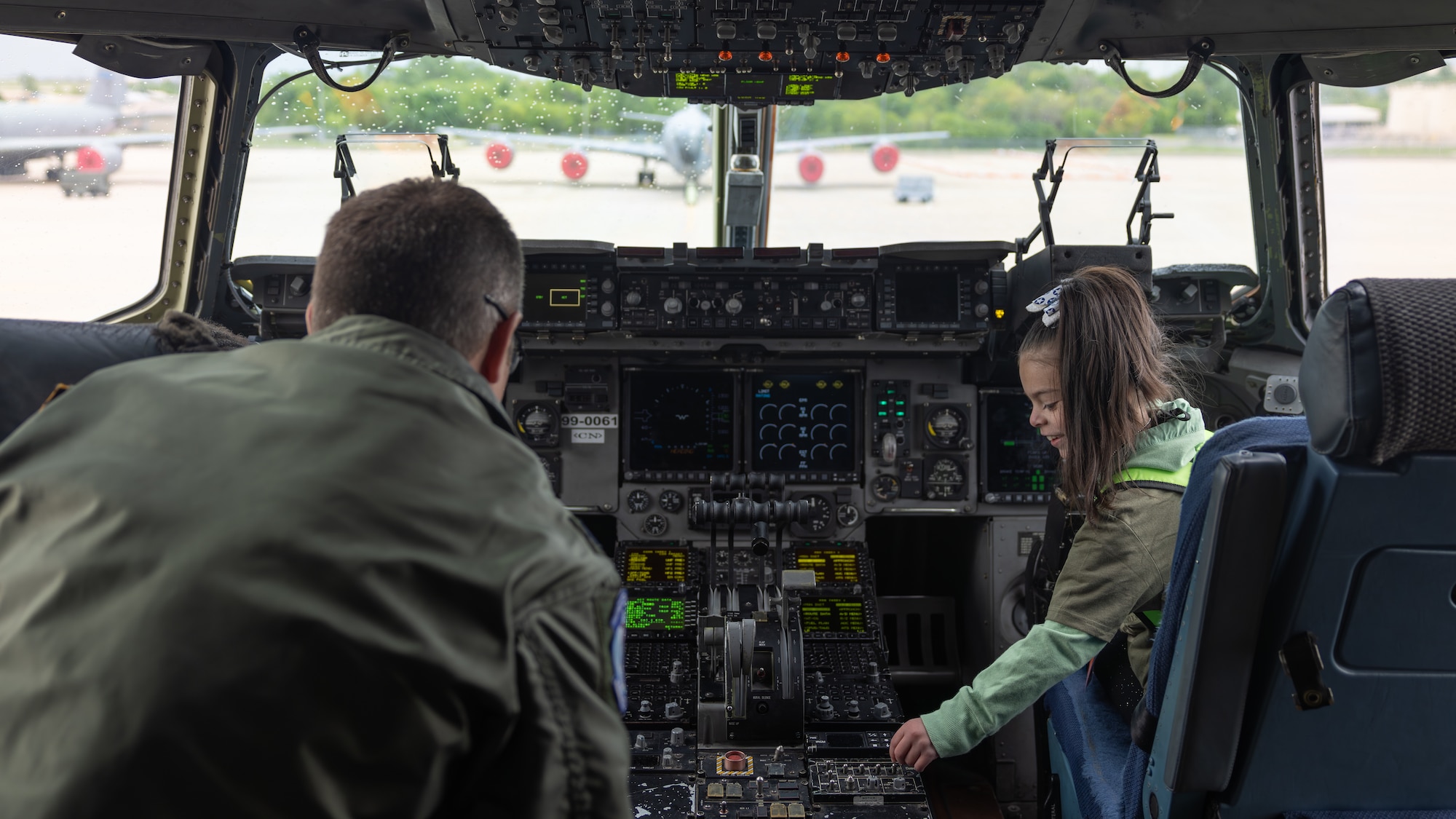 kids in airplane cockpit