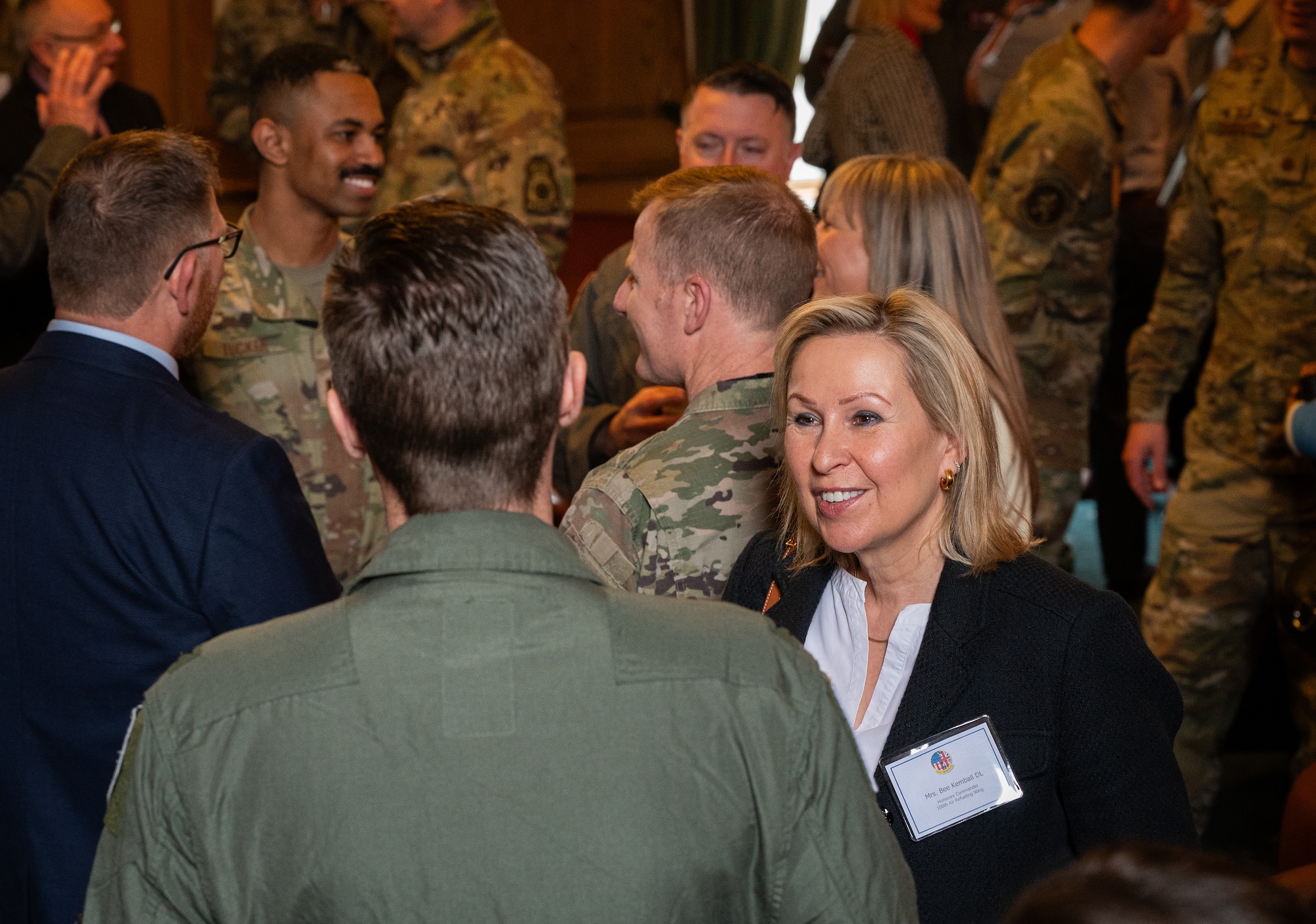 Bee Kemball, right, Suffolk Deputy Lieutenant, speaks with U.S. Air Force Col. Ryan Garlow, 100th Air Refueling Wing commander, during a refreshment break in honorary commanders’ induction ceremony at Royal Air Force Mildenhall, England, April 24, 2024.