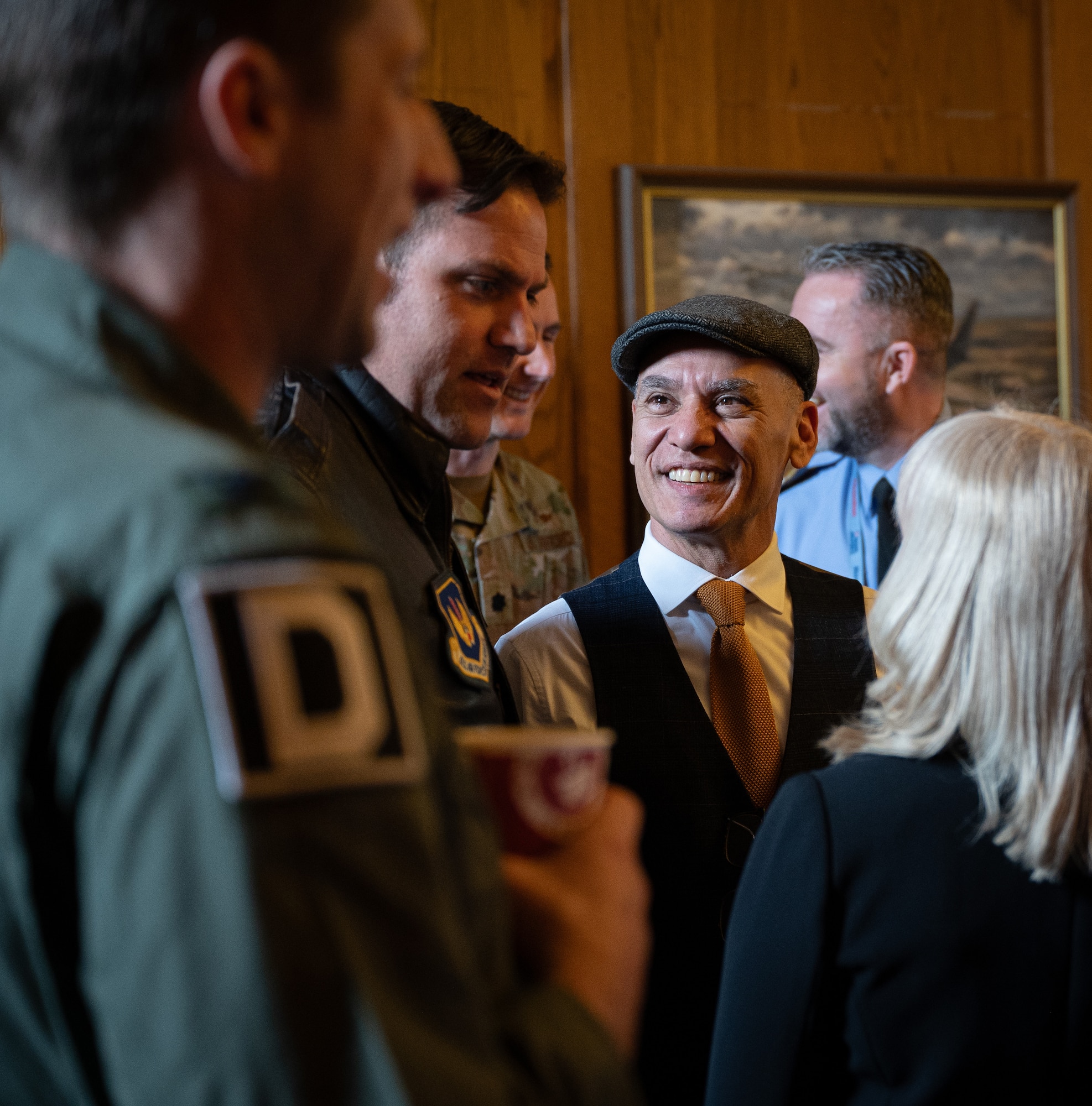 Robert Paley, Royal Air Force Mildenhall historian, center right, speaks with participants of the honorary commanders’ induction ceremony at RAF Mildenhall, England, April 24, 2024.