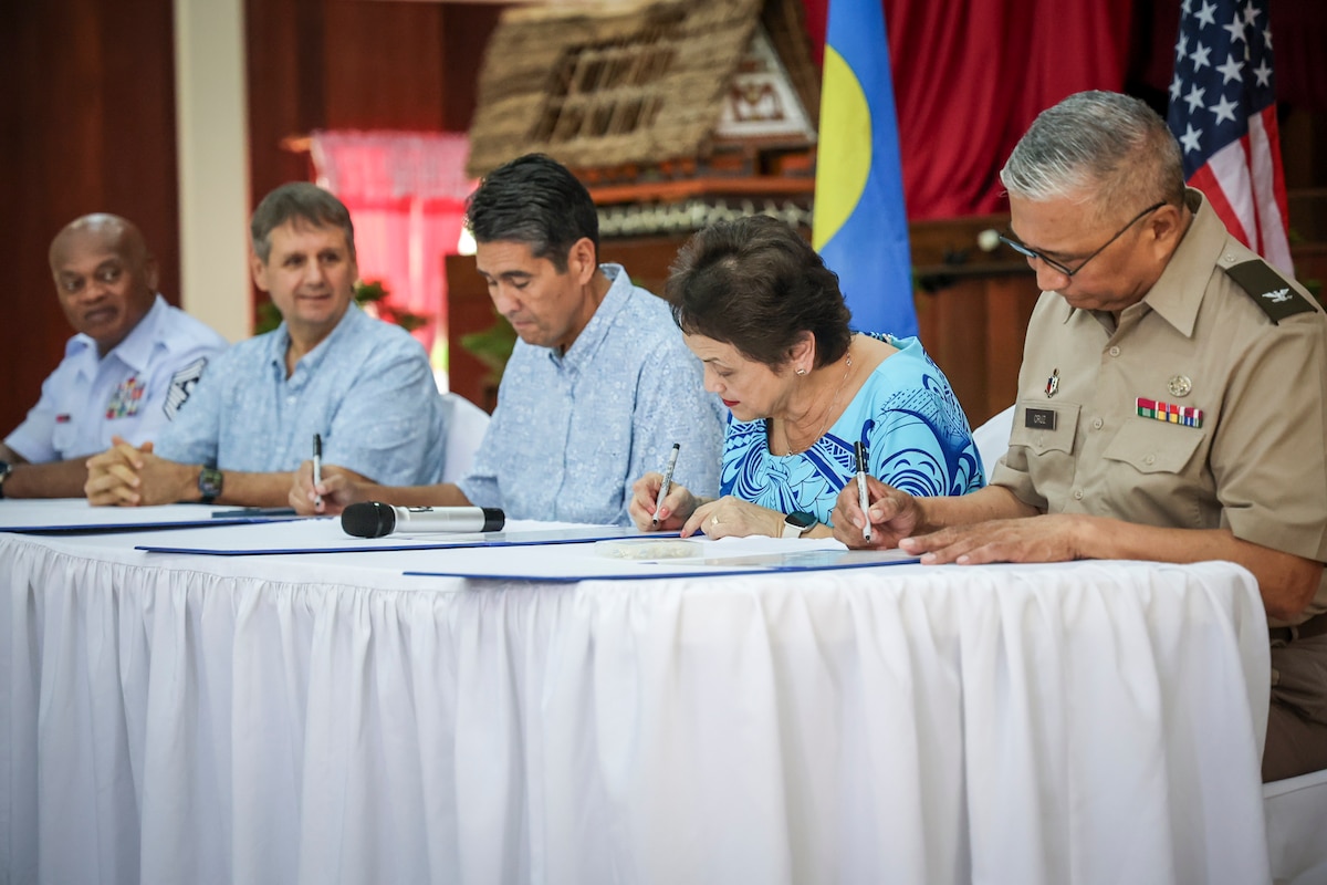 From left, Senior Enlisted Advisor Tony Whitehead, senior enlisted advisor to the chief of U.S. National Guard Bureau; U.S. Ambassador Joel Ehrendreich; Palau President Surangel Whipps; Guam Gov. Lou Leon Guerrero; and Col. Michael Cruz, adjutant general of the Guam National Guard, formalize a State Partnership Program partnership between Guam and Palau in Koror, Palau, April 29, 2024. The partnership builds on thousands of years of common ancestry between the Second Island Chain islands and seeks to mutually benefit both partners in defense and security cooperation.
