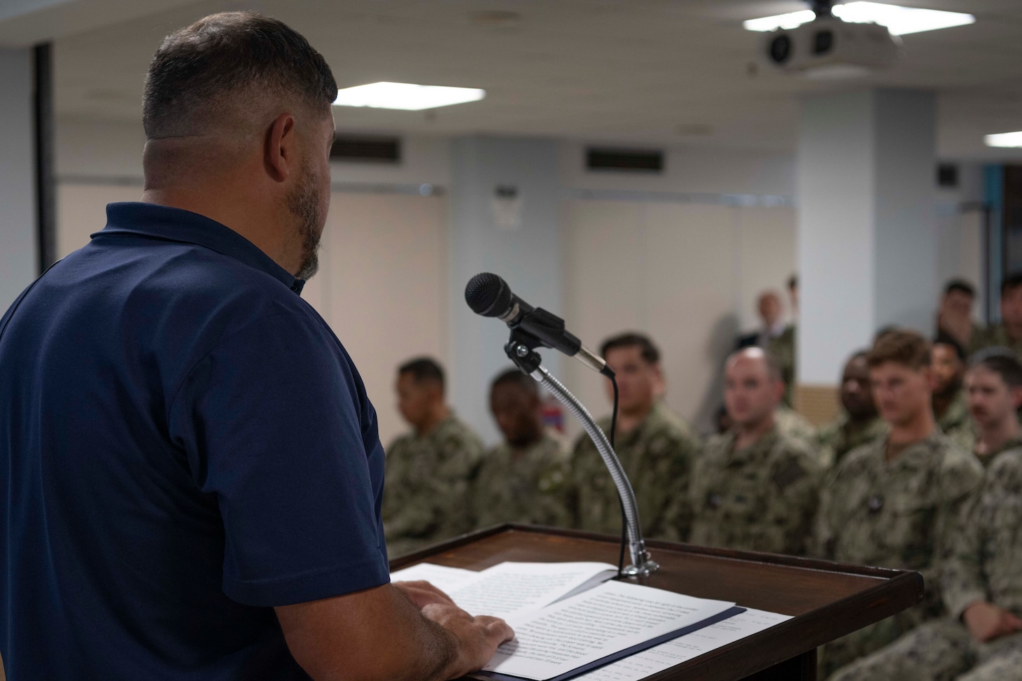 Retired Senior Chief Construction Mechanic, Francisco Landrau, assigned to Naval Support Activity Souda Bay, talks about his personal experience serving with Naval Mobile Construction Battalion (NMCB) 14 during a memorial service for NMCB-14  in The Anchor on May 2, 2024.