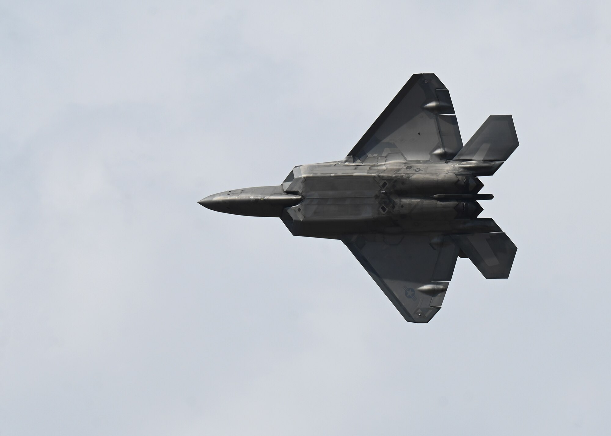 U.S. Air Force Capt. Samuel "RaZZ" Larson, F-22 Raptor Demonstration Team commander and pilot, performs an aerial maneuver during the Feria Internacional del Aire y del Espacio (FIDAE), an international air and space show, at Pudahuel Air Base, Chile, April 13, 2024.