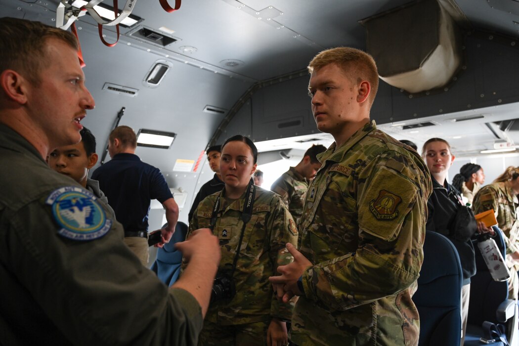 Dayna Nelson, center, and Seth Miser, right, U.S. Air Force ROTC cadets, listen to Staff Sgt. Austin Wilson, left, 56th Air Refueling Squadron boom operator instructor, at Altus Air Force Base, Oklahoma, April 25, 2024. The cadets had the opportunity at the end of the flight to ask air crew questions. (U.S. Air Force photo by Airman Lauren Torres)