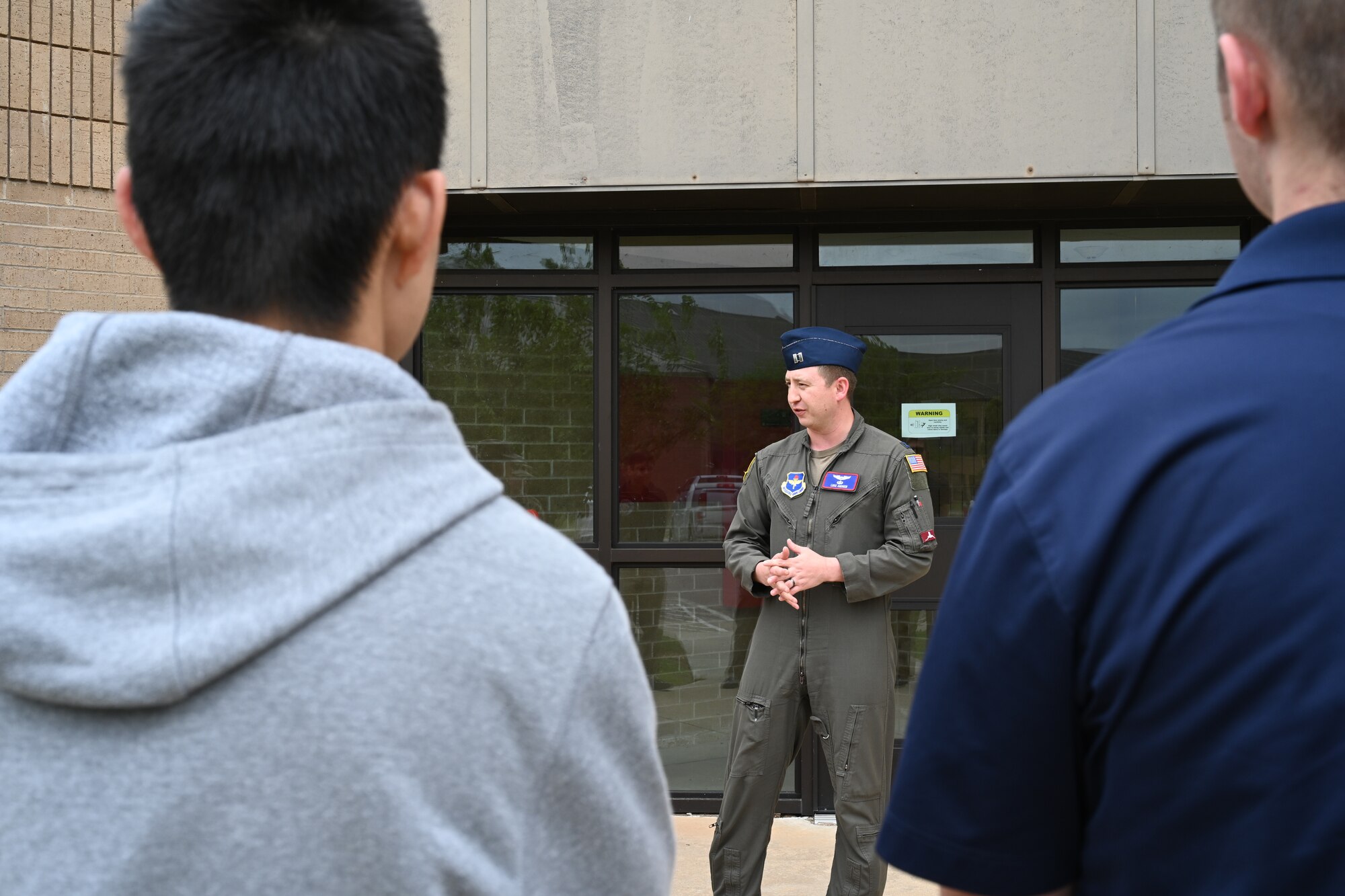 U.S. Air Force Capt. Luke Andrew, 54th Air Refueling Squadron (ARS) chief of scheduling, introduces himself to ROTC cadets at Altus Air Force Base, Oklahoma, April 25, 2024. The cadets toured the 54th ARS to learn about the daily operations of a flying squadron. (U.S. Air Force photo by Airman Lauren Torres)