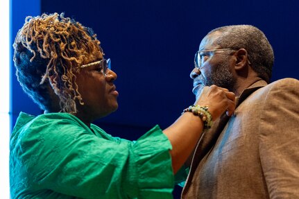 Renee Warren-Morrissette pins a Finance and Comptroller Hall of Fame regimental lapel pin on her husband, retired Command Sgt. Maj. Paul L. Morrissette, during a hall of fame induction ceremony at the Soldier Support Institute on Fort Jackson, South Carolina, April 26, 2024. Morrissette, a former Finance Corps regimental sergeant major, was made the third inductee of the hall of fame for his service and commitment to the U.S. Army Finance Corps for more than forty Years. (U.S. Army photo by Mark R. W. Orders-Woempner)