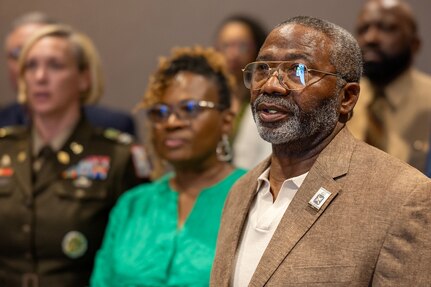 From right to left, retired Command Sgt. Maj. Paul L. Morrissette, his wife Renee Warren-Morrissette, and Col. Michelle M. Williams, U.S. Army Finance and Comptroller School commandant and Chief of the Finance Corps, sing the Army Song along with other guests during a Finance and Comptroller Hall of Fame induction ceremony at the Soldier Support Institute on Fort Jackson, South Carolina, April 26, 2024. Morrissette, a former Finance Corps regimental sergeant major, was made the third inductee of the hall of fame for his service and commitment to the U.S. Army Finance Corps for more than forty years. (U.S. Army photo by Mark R. W. Orders-Woempner)