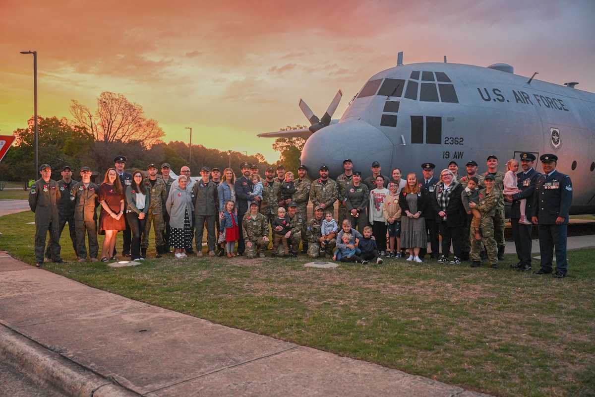 Members of the Royal New Zealand Air Force, families and friends stand together for a group photo during Anzac Day at Little Rock Air Force Base, Ark., April 25, 2024.