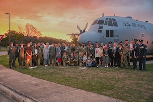 Members of the Royal New Zealand Air Force, families and friends stand together for a group photo during Anzac Day at Little Rock Air Force Base, Ark., April 25, 2024.
