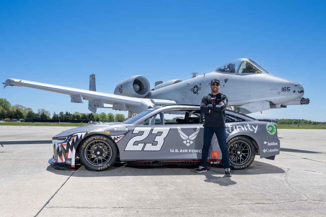 Bubba Wallace, Würth 400 NASCAR Cup Series driver, poses with his No. 23 Toyota Camry and a U.S. Air Force A-10C Thunderbolt II at Dover Air Force Base, Delaware, April 26, 2024. Wallace toured Dover AFB before the weekend’s race at Dover Motor Speedway. (U.S. Air Force photo by Mauricio Campino)