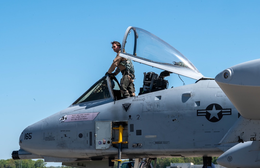 U.S. Air Force Maj. Nicholas Hope, 104th Fighter Wing pilot, climbs out of an A-10C Thunderbolt II at Dover Air Force Base, Delaware, April 26, 2024. The tour was held for Bubba Wallace, Würth 400 NASCAR Cup Series driver, who was visiting Dover AFB before the weekend’s race at Dover Motor Speedway. (U.S. Air Force photo by Airman Liberty Matthews)