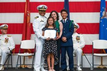A family poses for a photo.