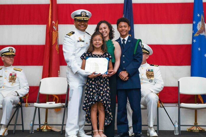 A family poses for a photo.