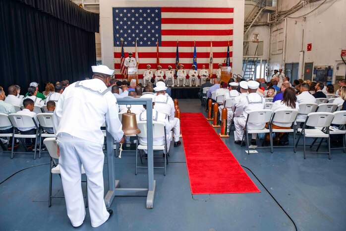Attendees watch a ceremony.