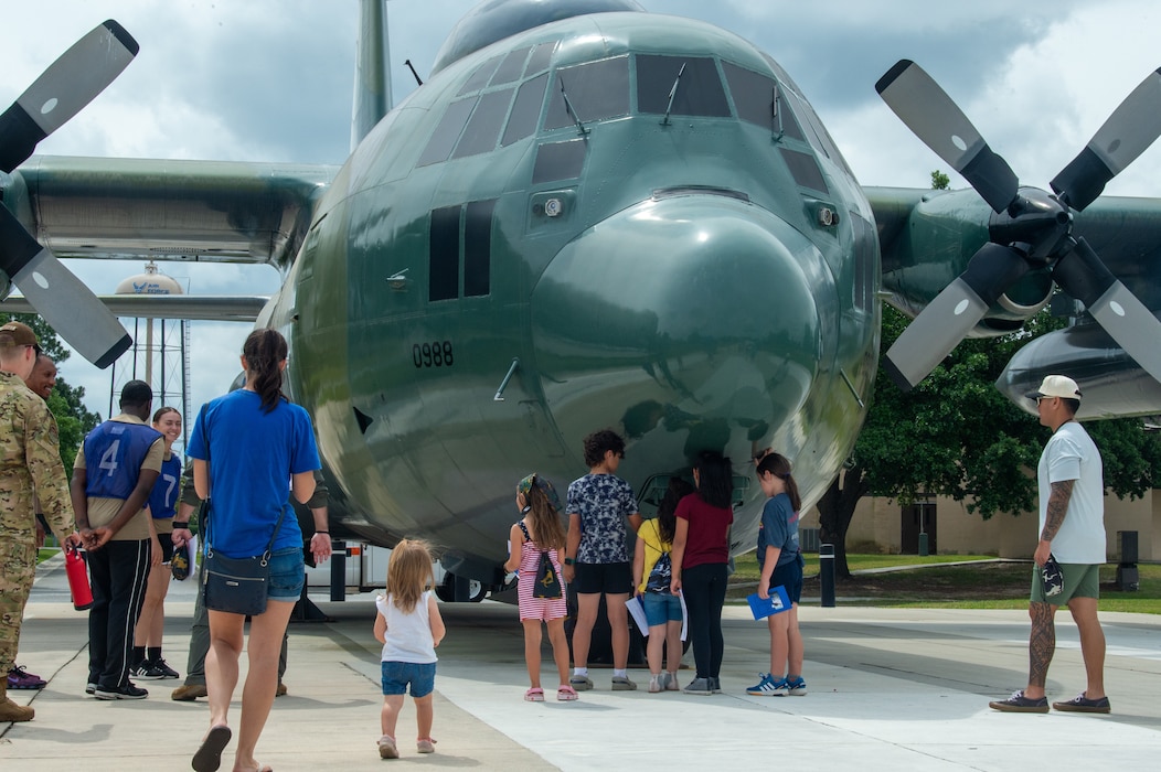 Families standing around an aircraft display