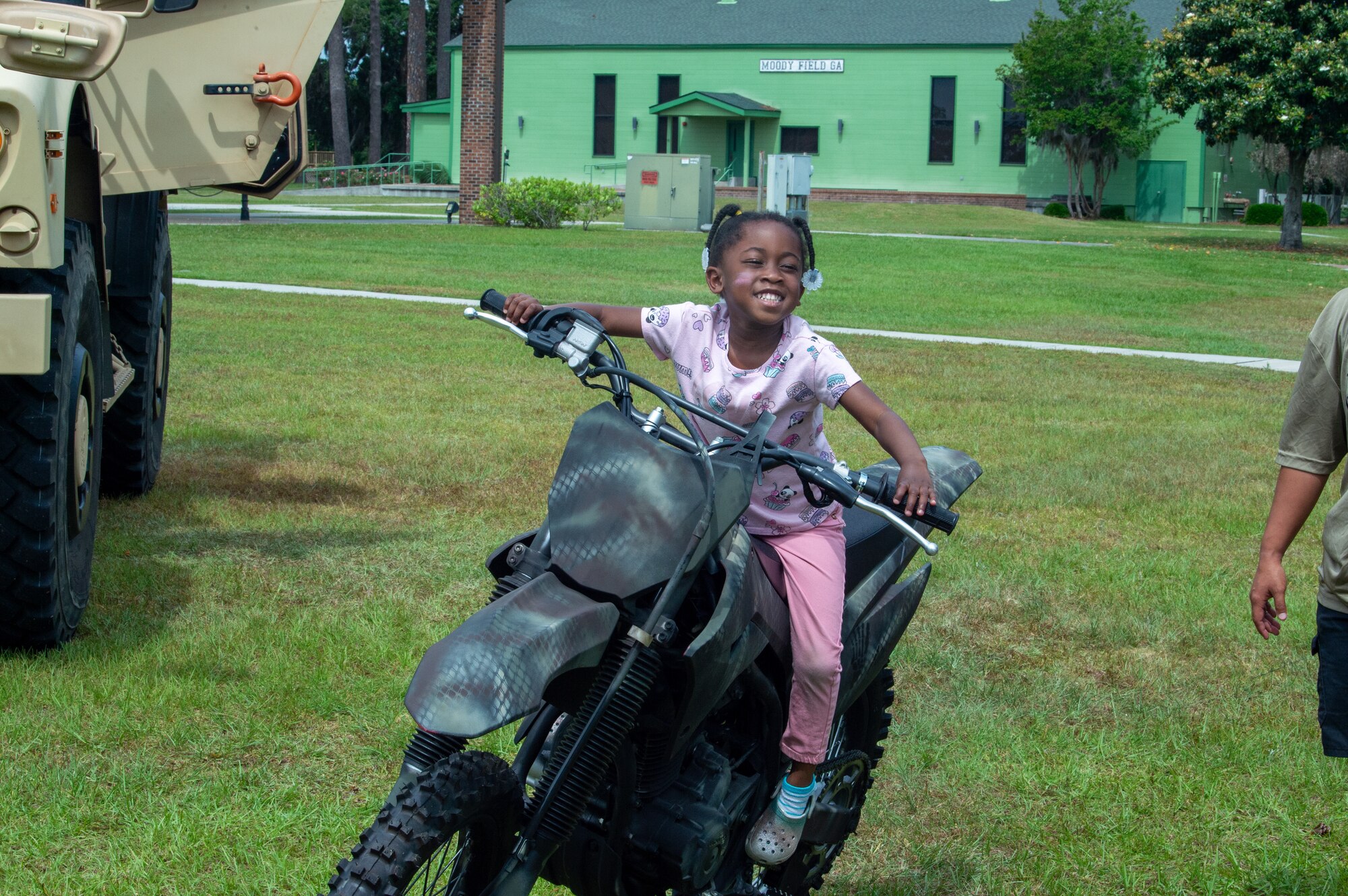 Young girl sitting on a motorcycle