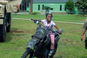 Young girl sitting on a motorcycle