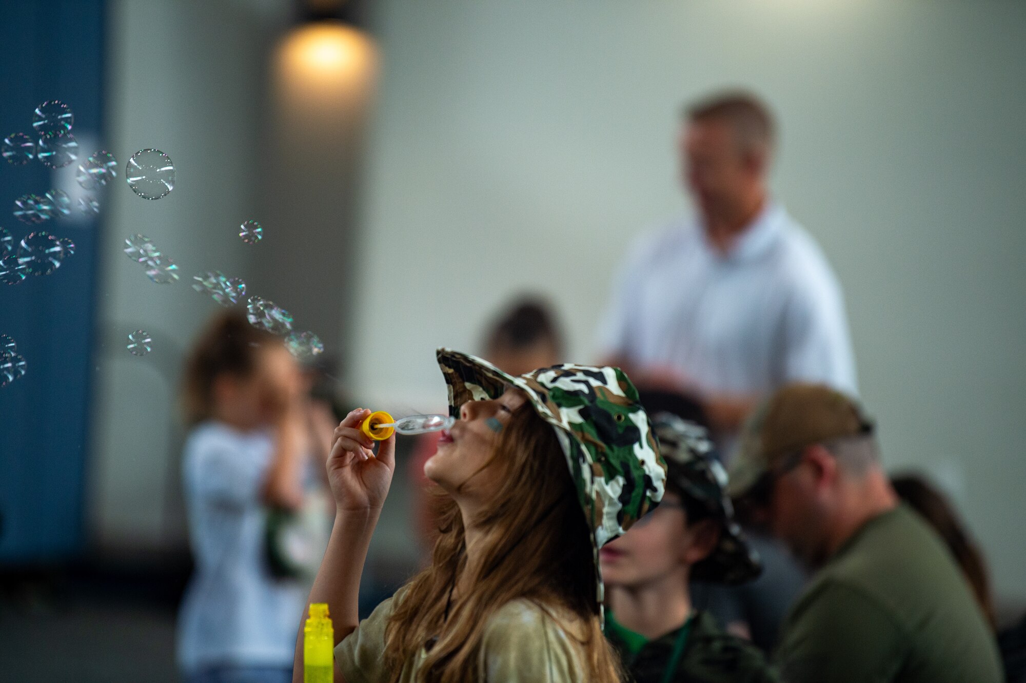 Young girl blowing bubbles