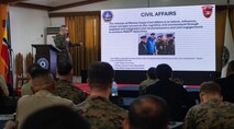 Lt. Col. Chris Bridger, 1st Civil Affairs Group Combined Joint Civil-Military Task Force deputy commander, gives a brief on Marine Corps Civil Affairs during a Civil-Military Operations subject matter expert exchange as part of Exercise Balikatan 24 at Camp Aguinaldo, Manila,  Philippines, April 29, 2024. Armed Forces of the Philippines and U.S. CMO specialists shared the best civil affairs practices and their experiences when military forces were called to support civilian populations during the COVID-19 pandemic, natural disasters, and refugee crises. BK 24 is an annual exercise between the Armed Forces of the Philippines and the U.S. military designed to strengthen bilateral interoperability, capabilities, trust, and cooperation built over decades of shared experiences. (U.S. Air Force photo by Staff Sgt. Pedro Tenorio)