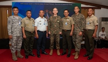 Armed Forces of the Philippines and U.S. Marine Corps service members pose for a photo at the Civil-Military Operations subject matter expert exchange during Exercise Balikatan 24 at Camp Aguinaldo, Philippines, April 29, 2024. AFP and U.S. military CMO specialists joined together to share the best civil affairs practices and their experiences when military forces were called to support civilian populations during the COVID-19 pandemic, natural disasters, and refugee crises. BK 24 is an annual exercise between the Armed Forces of the Philippines and the U.S. military designed to strengthen bilateral interoperability, capabilities, trust, and cooperation built over decades of shared experiences. (U.S. Air Force photo by Staff Sgt. Pedro Tenorio) (This photo has been altered for security purposes by blurring out identification badges.)